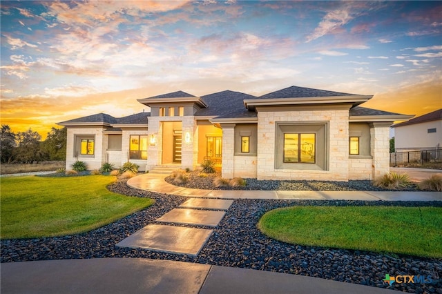 prairie-style home featuring a yard