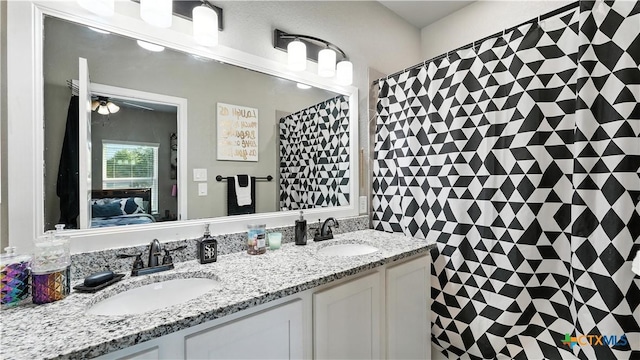 911-913 E Seideman St, Seguin, TX 78155 - full bathroom featuring connected bathroom, double vanity, and a shower with shower curtain