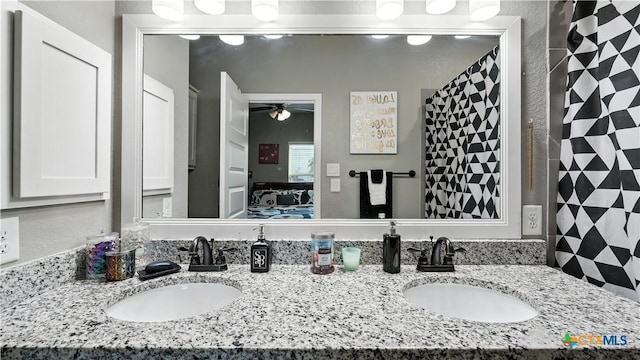 911-913 E Seideman St, Seguin, TX 78155 - bathroom with double vanity, connected bathroom, and a ceiling fan