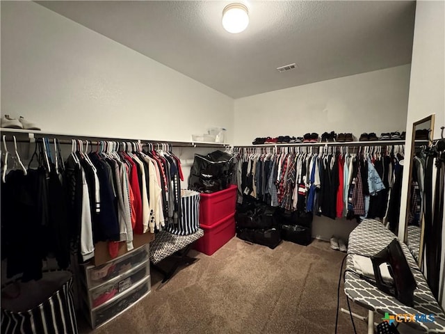 walk in closet featuring carpet floors and visible vents