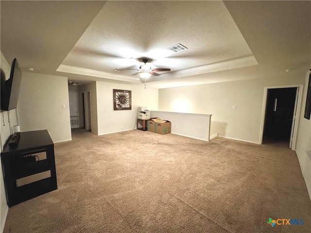 interior space featuring a ceiling fan, carpet, visible vents, and a textured ceiling