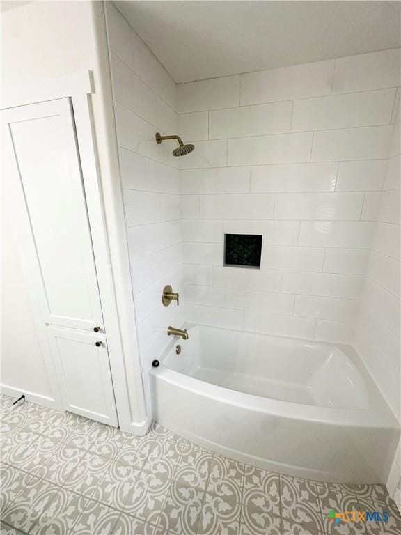 bathroom with tile patterned flooring and tiled shower / bath combo