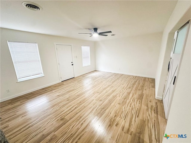 interior space with ceiling fan and light wood-type flooring