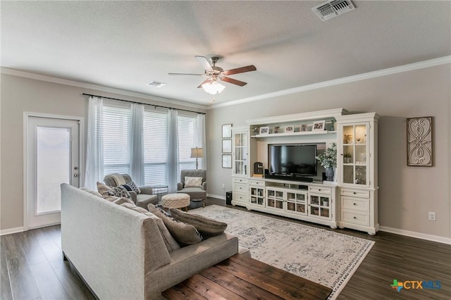 611 Hawks Shadow Dr, Temple, TX 76502 - living area with baseboards, a ceiling fan, dark wood-style floors, crown molding, and a textured ceiling