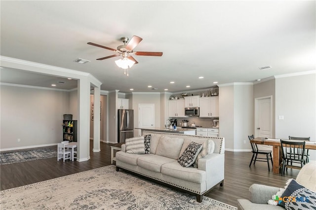 611 Hawks Shadow Dr, Temple, TX 76502 - living area with recessed lighting, ceiling fan, dark wood-style floors, baseboards, and crown molding