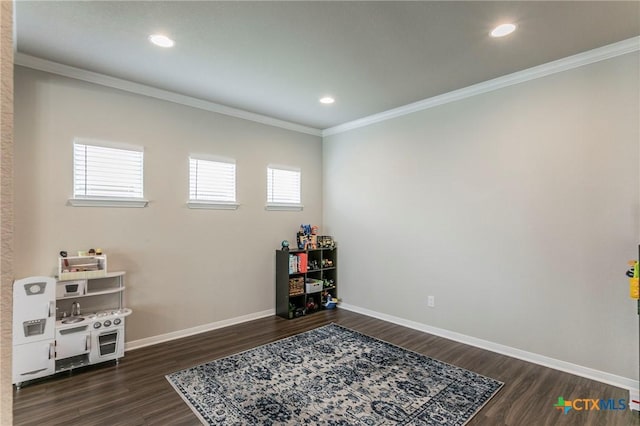 611 Hawks Shadow Dr, Temple, TX 76502 - playroom featuring dark wood-style floors, ornamental molding, and recessed lighting