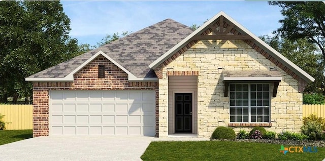611 Hawks Shadow Dr, Temple, TX 76502 - view of front of home featuring an attached garage, fence, concrete driveway, and stone siding
