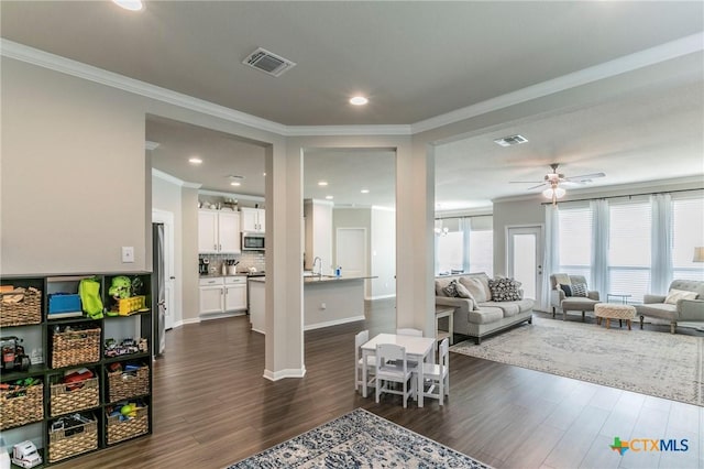 611 Hawks Shadow Dr, Temple, TX 76502 - living room with ornamental molding, dark wood finished floors, a ceiling fan, recessed lighting, and baseboards