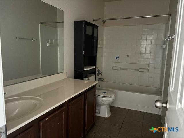 224 Starlight Dr, Temple, TX 76502 - bathroom with toilet, vanity, tile patterned floors, and bathing tub / shower combination