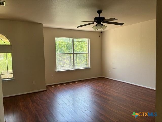 224 Starlight Dr, Temple, TX 76502 - spare room featuring baseboards, a ceiling fan, wood finished floors, and visible vents