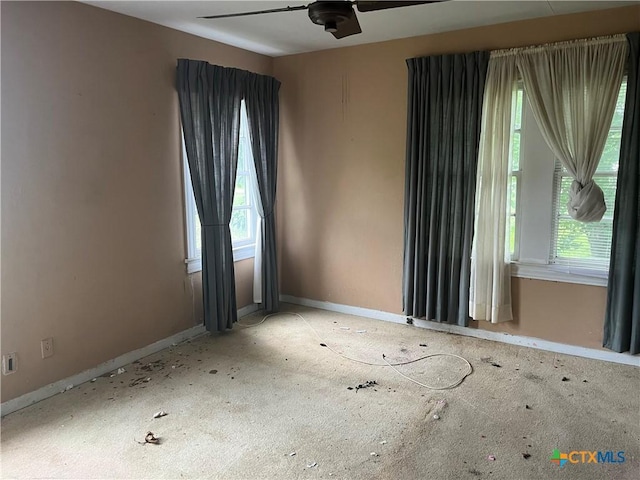 406 Lariat Ln, Victoria, TX 77901 - unfurnished room featuring plenty of natural light, baseboards, and ceiling fan