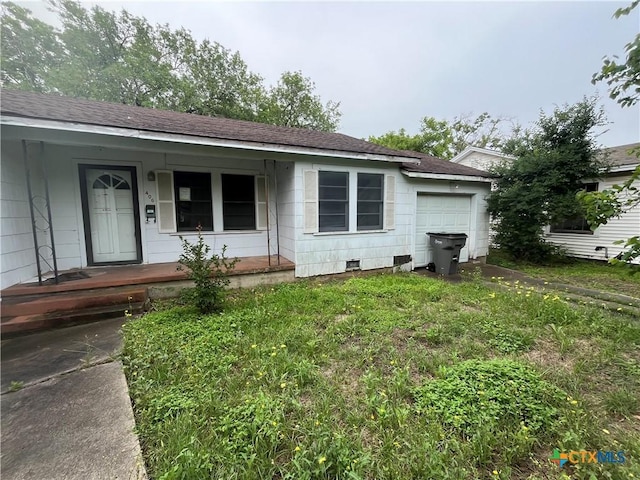406 Lariat Ln, Victoria, TX 77901 - ranch-style house with a porch, roof with shingles, a garage, and crawl space