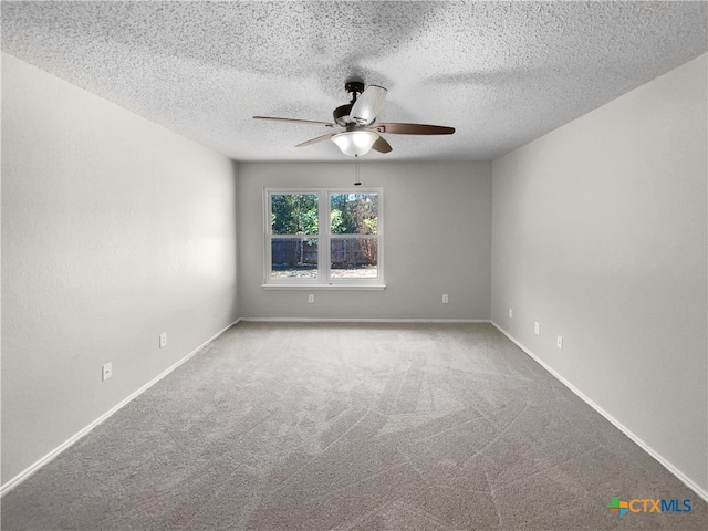 spare room with ceiling fan, carpet, and a textured ceiling