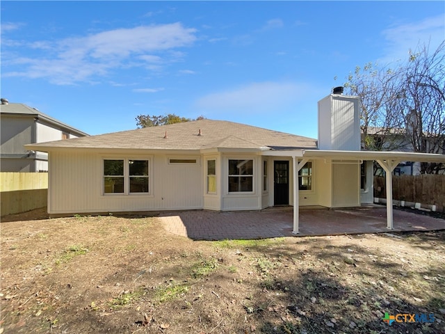 back of property with a patio area