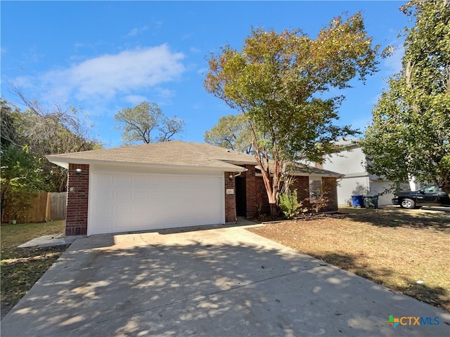 single story home featuring a garage