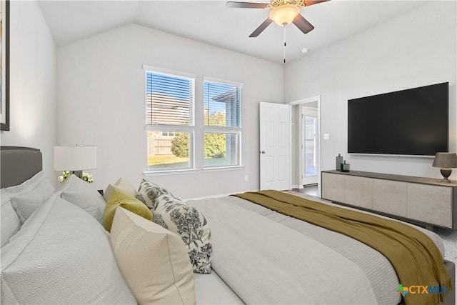 bedroom featuring ceiling fan and lofted ceiling