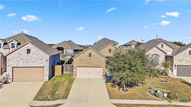 view of front facade featuring a garage and a front lawn