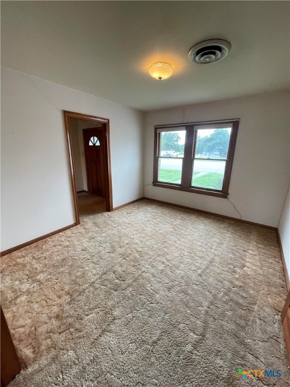 view of carpeted spare room