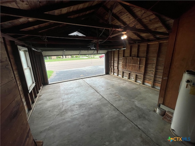 garage with water heater and wooden ceiling