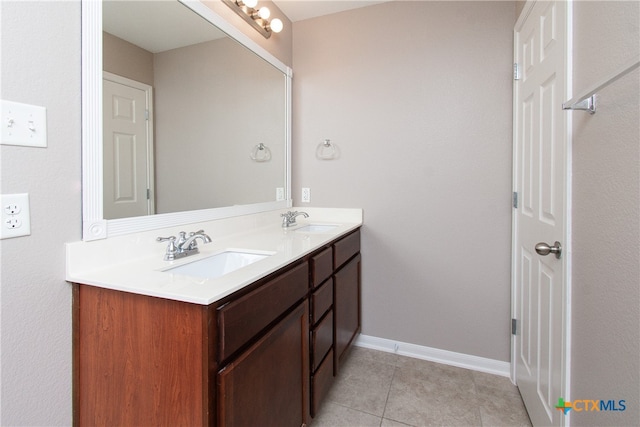 bathroom with tile patterned flooring and vanity