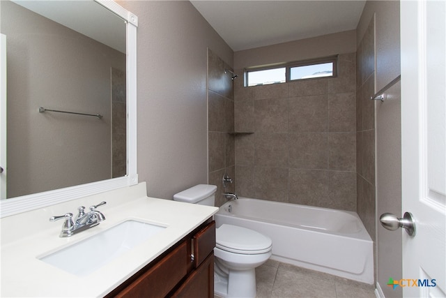 full bathroom with vanity, tile patterned flooring, tiled shower / bath, and toilet