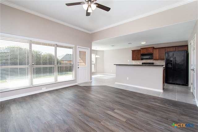 kitchen with black appliances, crown molding, ceiling fan, decorative backsplash, and dark hardwood / wood-style flooring