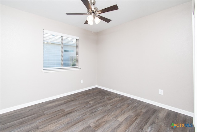 empty room with dark hardwood / wood-style floors and ceiling fan