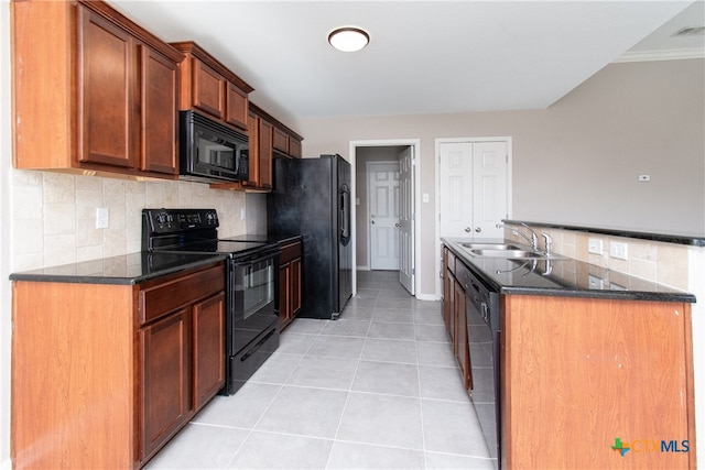 kitchen with decorative backsplash, ornamental molding, sink, black appliances, and light tile patterned floors