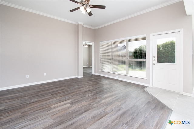 unfurnished room featuring hardwood / wood-style floors, ceiling fan, and crown molding