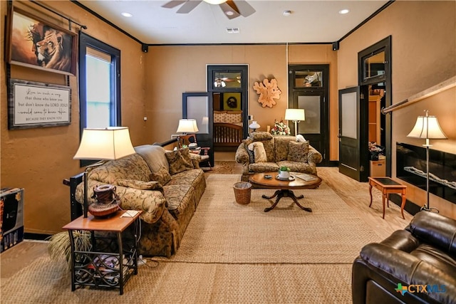 122 E Main St, Cuero, TX 77954 - living room featuring ceiling fan, wood finished floors, recessed lighting, and ornamental molding