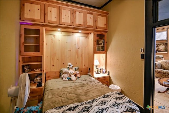 122 E Main St, Cuero, TX 77954 - bedroom with a textured wall