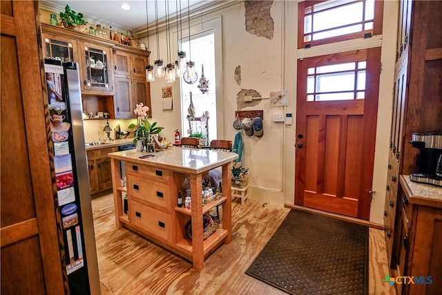 122 E Main St, Cuero, TX 77954 - foyer featuring light wood-style flooring and ornamental molding