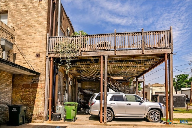 122 E Main St, Cuero, TX 77954 - view of vehicle parking with stairs