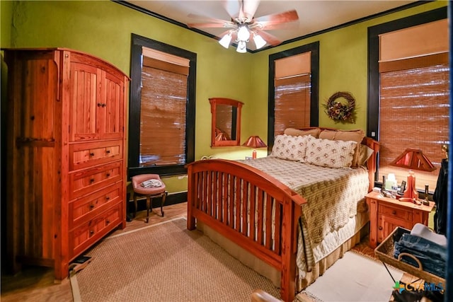 122 E Main St, Cuero, TX 77954 - bedroom featuring a ceiling fan and crown molding