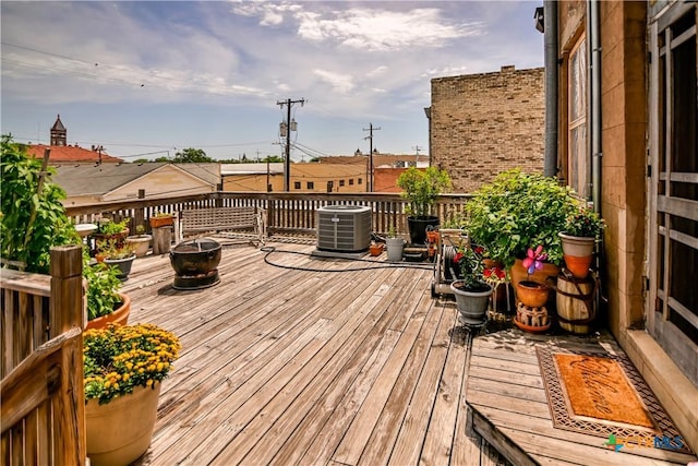 122 E Main St, Cuero, TX 77954 - wooden terrace featuring cooling unit