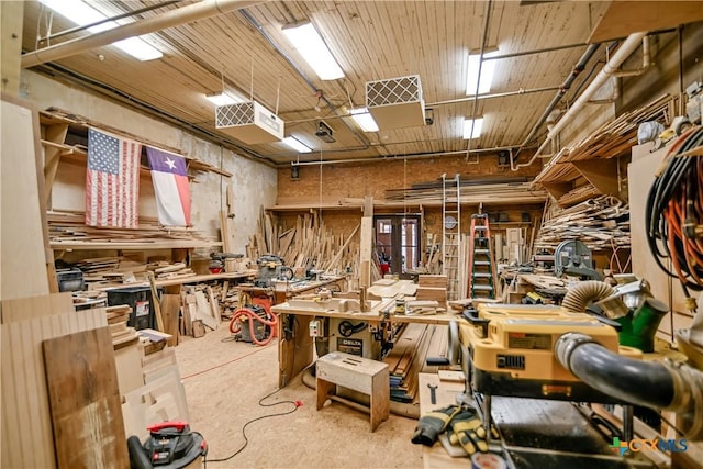 122 E Main St, Cuero, TX 77954 - miscellaneous room with a workshop area and concrete floors