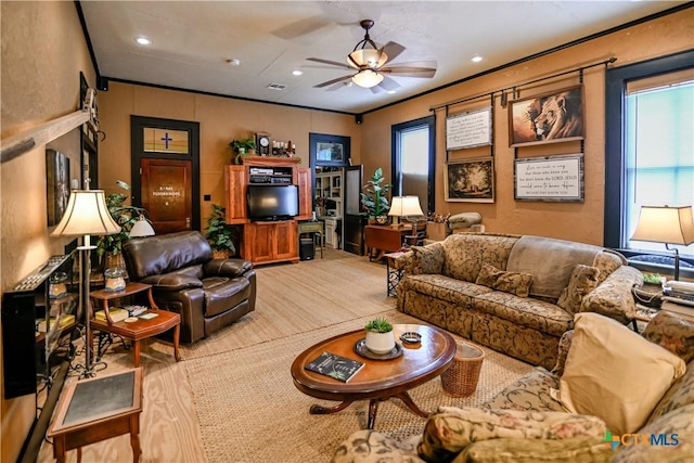 122 E Main St, Cuero, TX 77954 - living room featuring ceiling fan, recessed lighting, and ornamental molding