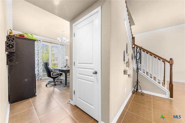 interior space featuring tile patterned flooring and an inviting chandelier