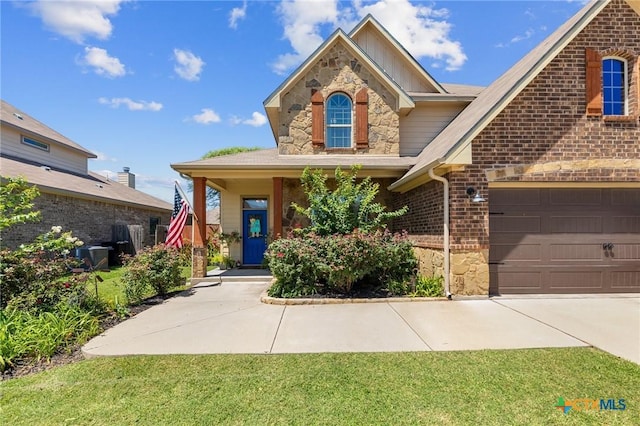 view of front of home with a garage and a front yard