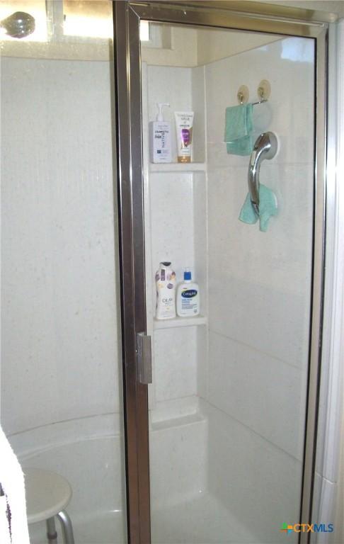 bathroom with walk in shower