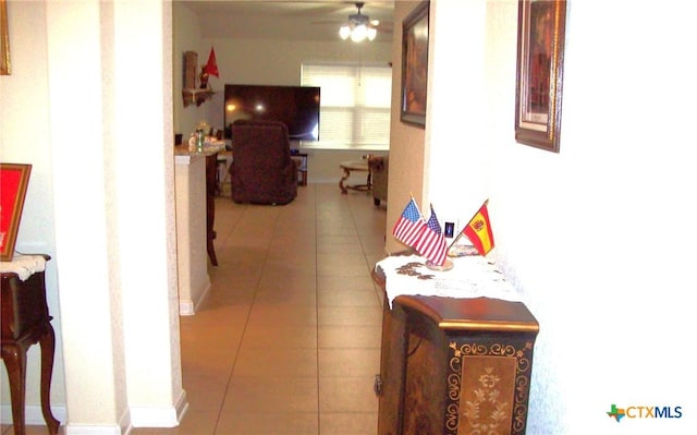 corridor with light tile patterned flooring