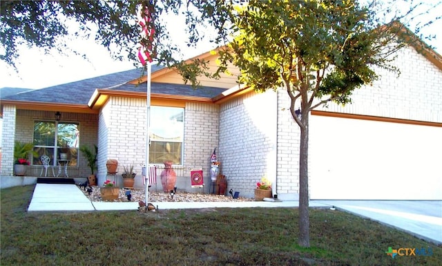 rear view of property featuring a lawn