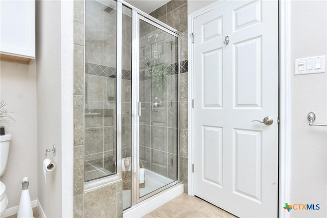 3404 American Dr Unit 3315, Lago Vista, TX 78645 - bathroom featuring a shower stall, tile patterned floors, and toilet