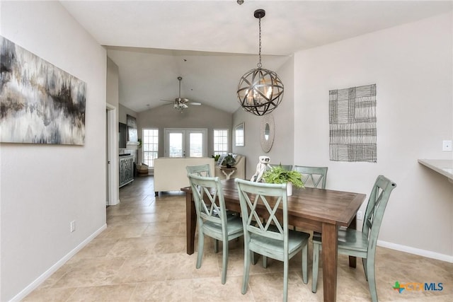 3404 American Dr Unit 3315, Lago Vista, TX 78645 - dining space featuring baseboards, a fireplace, ceiling fan with notable chandelier, and vaulted ceiling