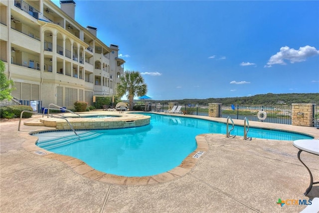 3404 American Dr Unit 3315, Lago Vista, TX 78645 - community pool with a patio area, fence, and a hot tub