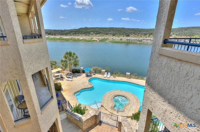3404 American Dr Unit 3315, Lago Vista, TX 78645 - view of swimming pool with a water view and a patio