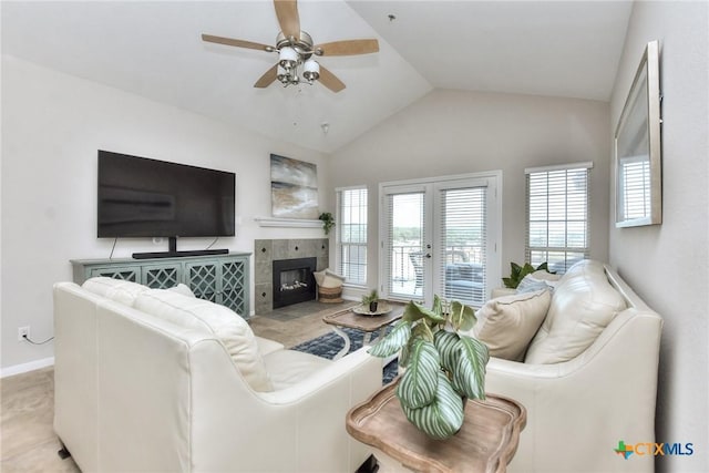3404 American Dr Unit 3315, Lago Vista, TX 78645 - living room featuring a ceiling fan, a tile fireplace, lofted ceiling, french doors, and baseboards