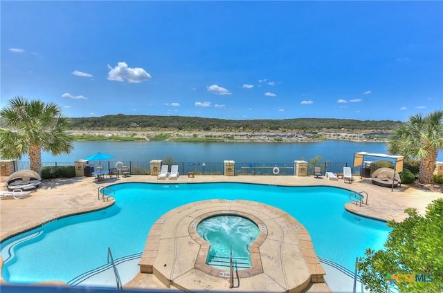 3404 American Dr Unit 3315, Lago Vista, TX 78645 - community pool featuring a water view, a patio area, fence, and a community hot tub