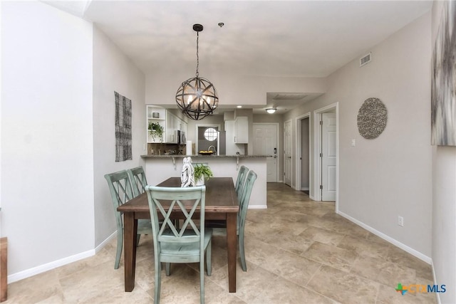 3404 American Dr Unit 3315, Lago Vista, TX 78645 - dining space with a chandelier, baseboards, and visible vents