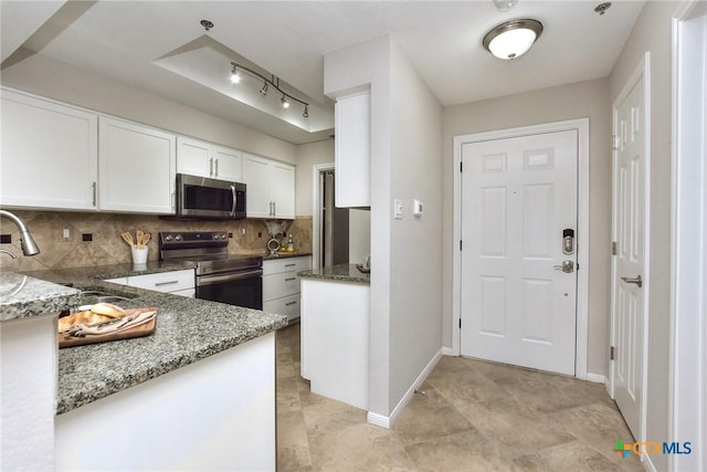 3404 American Dr Unit 3315, Lago Vista, TX 78645 - kitchen with tasteful backsplash, light stone counters, white cabinetry, stainless steel appliances, and a sink